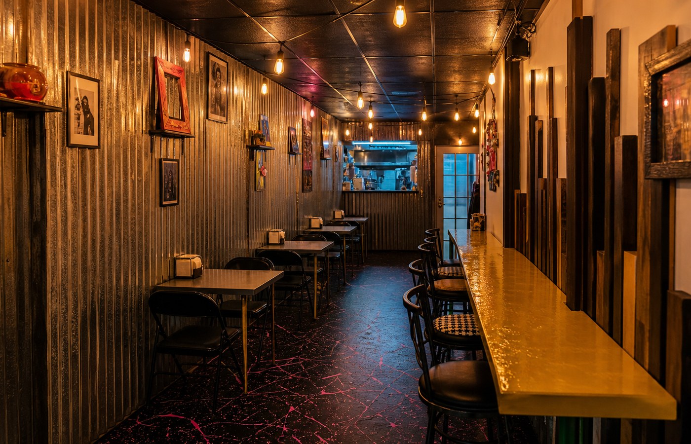 El Lado Bueno dining room with warm lights and corrugated metal walls